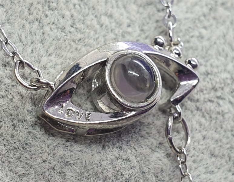 Eye of Ra Projector Necklace with \"I love you\"